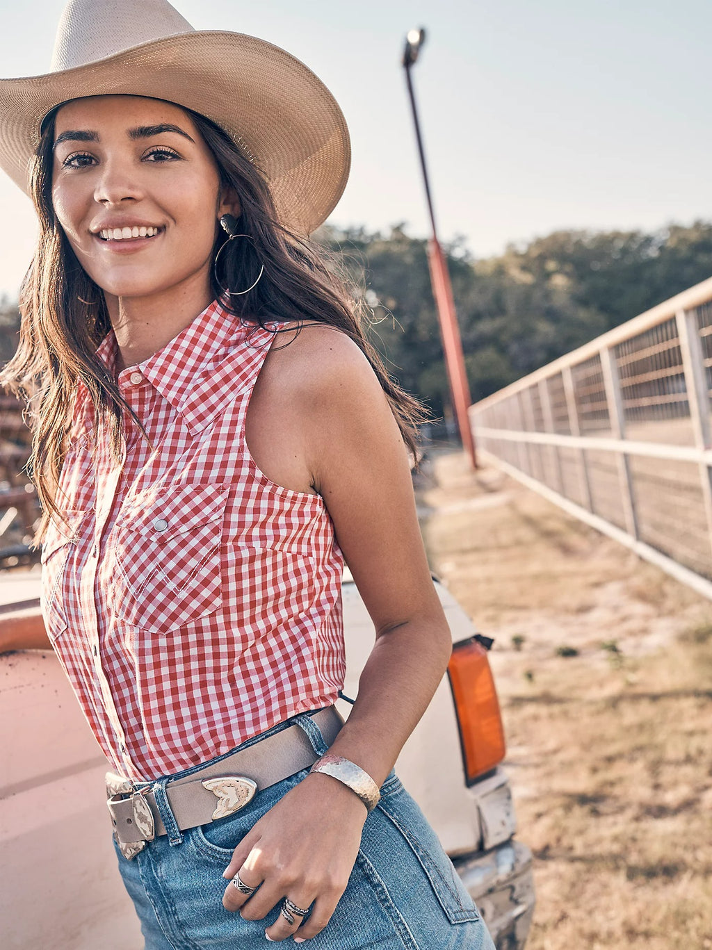 The Lucy Gingham Pearl Snap Sleeveless Shirt by Wrangler